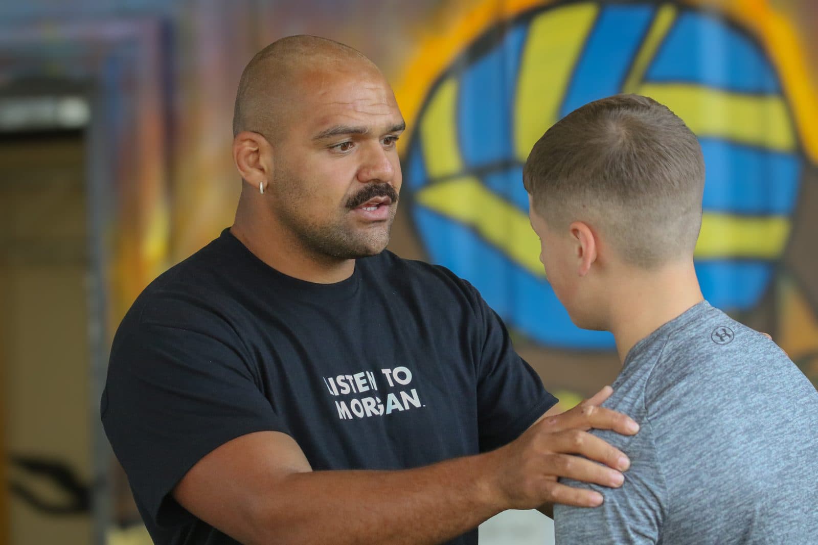 Morgan talking an athlete through a movement